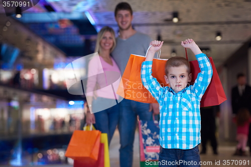 Image of young family with shopping bags