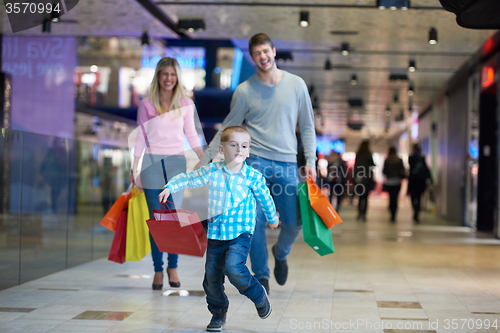 Image of young family with shopping bags