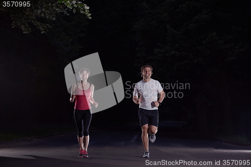 Image of couple jogging at early morning