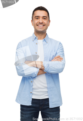 Image of smiling man with crossed arms