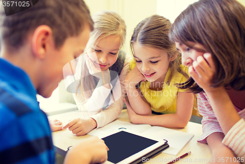 Image of group of school kids with tablet pc in classroom