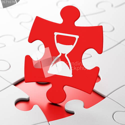 Image of Time concept: Hourglass on puzzle background