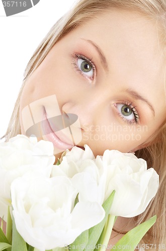 Image of happy girl with white tulips