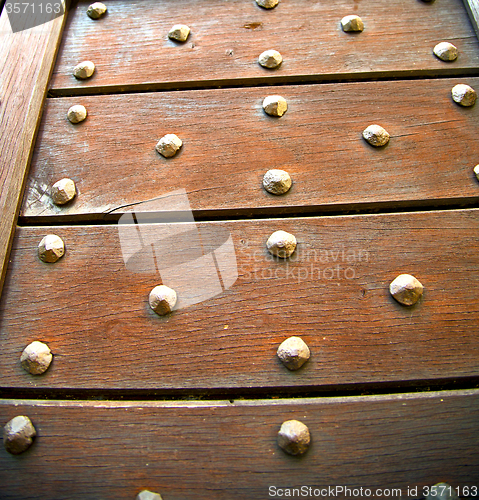 Image of  cross lombardy   arsago   rusty brass brown   closed wood  