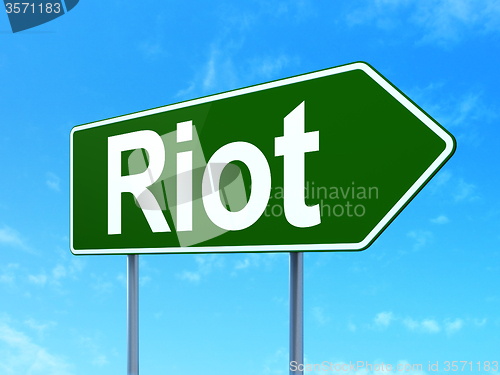 Image of Political concept: Riot on road sign background