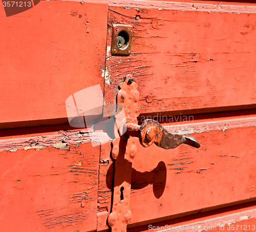 Image of door    in italy old ancian wood and traditional  texture nail