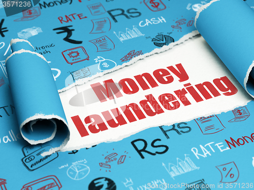 Image of Banking concept: red text Money Laundering under the piece of  torn paper