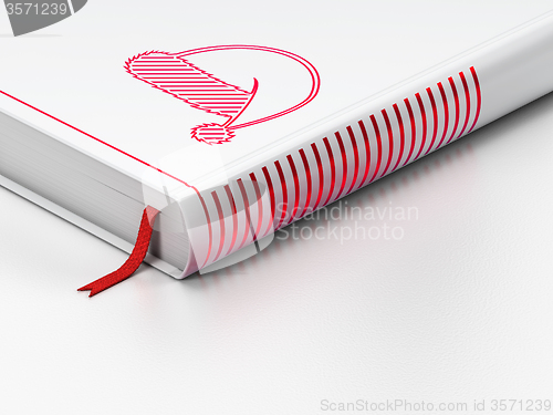 Image of Holiday concept: closed book, Christmas Hat on white background