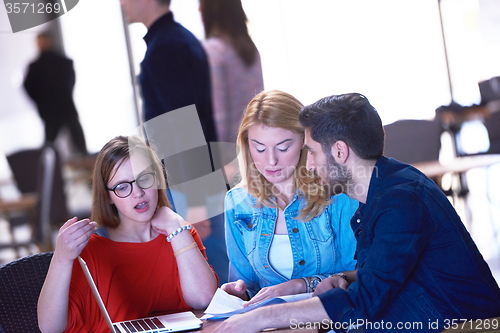 Image of students group working on school  project  together