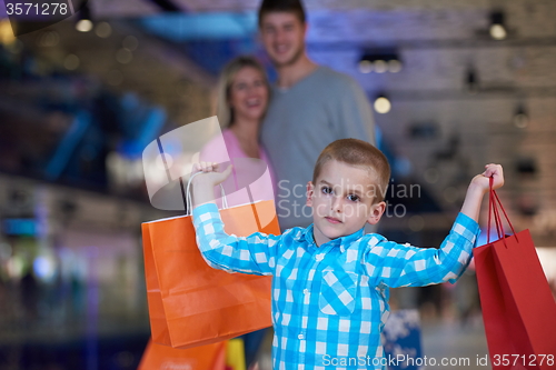 Image of young family with shopping bags