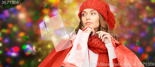 Image of woman in winter clothes with shopping bags