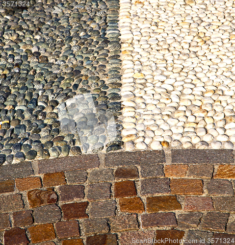 Image of near mozzate street lombardy italy   pavement of a curch and  ma