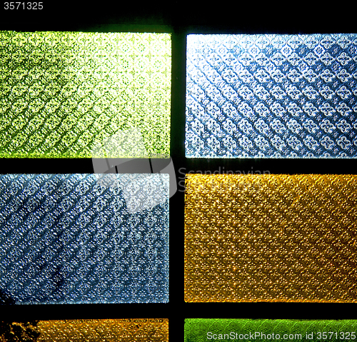 Image of colorated glass and sun in morocco africa window and light