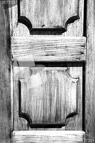 Image of texture of a brown old door in italy europe