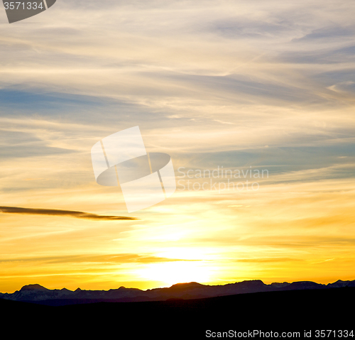 Image of sunrise in the colored sky white soft clouds and abstract backgr