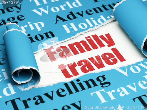 Image of Vacation concept: red text Family Travel under the piece of  torn paper