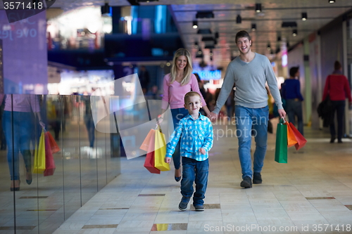 Image of young family with shopping bags