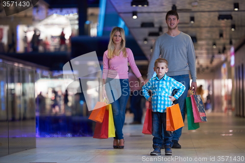 Image of young family with shopping bags