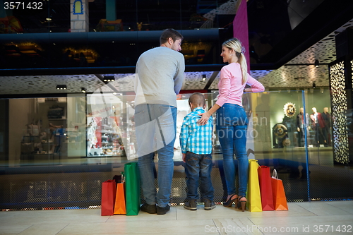 Image of young family with shopping bags