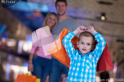 Image of young family with shopping bags