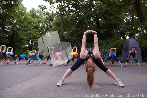 Image of jogging people group stretching