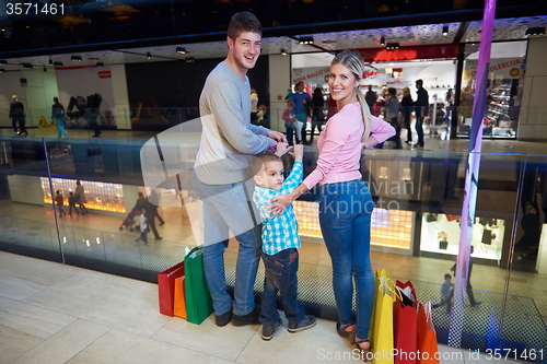 Image of young family with shopping bags