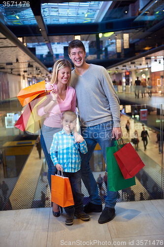 Image of young family with shopping bags