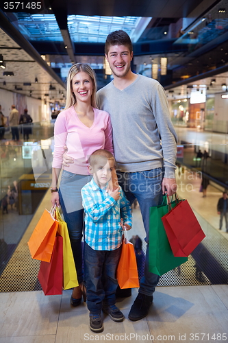 Image of young family with shopping bags