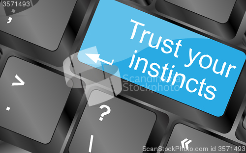 Image of Trust your instincts. Computer keyboard keys with quote button. Inspirational motivational quote. Simple trendy design