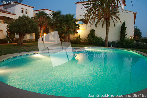 Image of Villas with swimming pool by night
