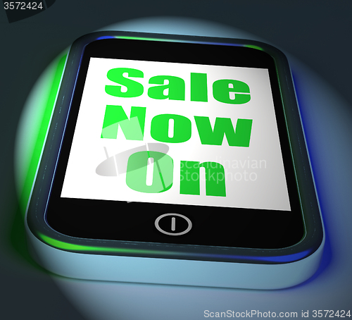 Image of Sale Now On Phone Displays Promotional Savings Or Discounts