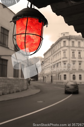 Image of red torch on old street