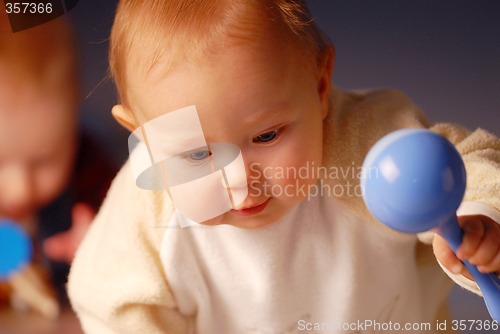 Image of Baby playing with a toy