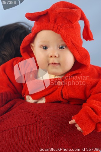 Image of A child dressed in red