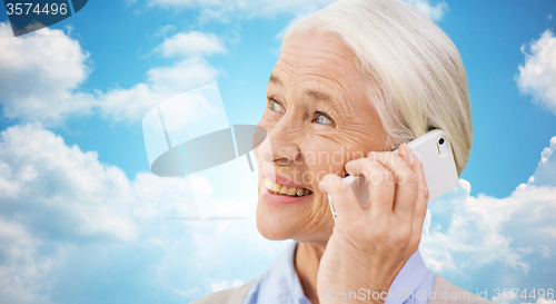 Image of senior woman with smartphone calling