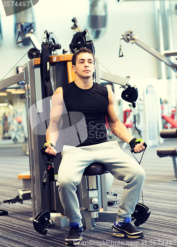 Image of man exercising on gym machine