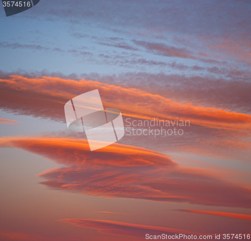 Image of sunrise in the colored sky white soft clouds and abstract backgr