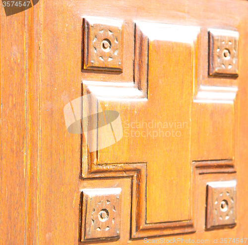 Image of texture of a brown old door in italy europe