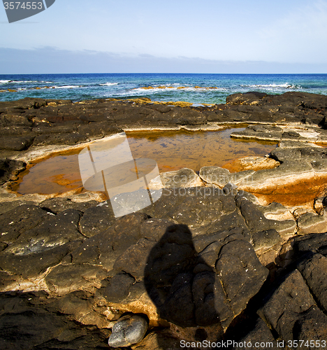 Image of in spain  lanzarote  rock stone sky cloud beach  