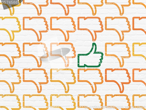 Image of Social network concept: thumb up icon on wall background