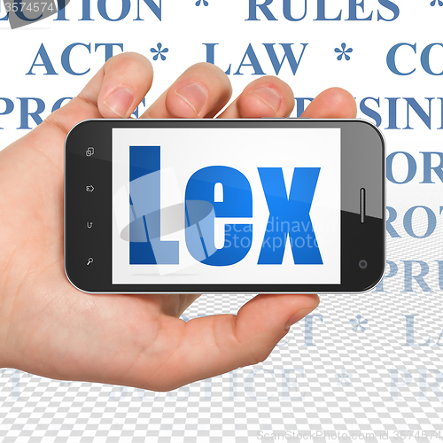 Image of Law concept: Hand Holding Smartphone with Lex on display