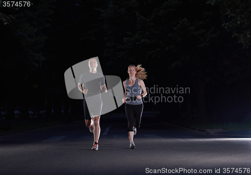 Image of couple jogging at early morning