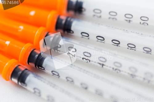 Image of close up of insulin syringes on table