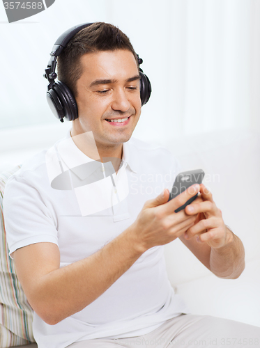 Image of happy man with smartphone and headphones