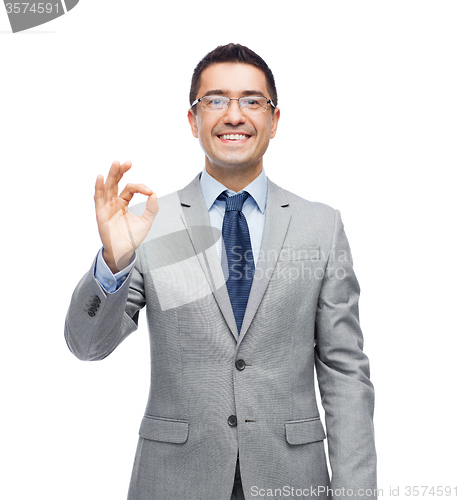 Image of happy smiling businessman in eyeglasses and suit