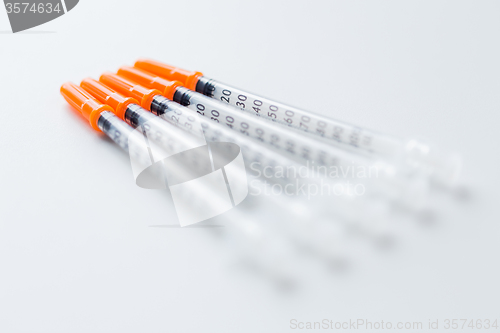 Image of close up of insulin syringes on table