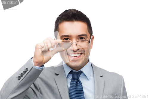 Image of happy smiling businessman in eyeglasses and suit