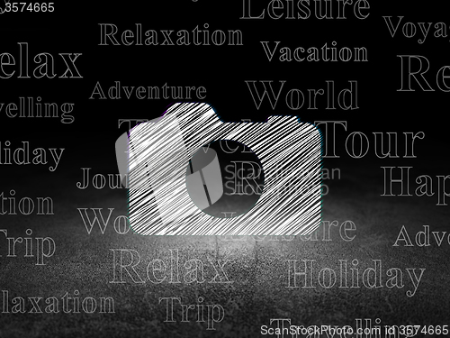 Image of Travel concept: Photo Camera in grunge dark room