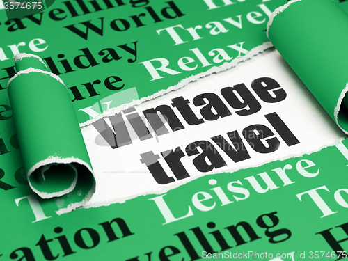 Image of Tourism concept: black text Vintage Travel under the piece of  torn paper