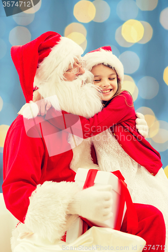 Image of smiling little girl with santa claus